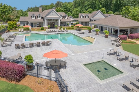 A large house with a pool and a patio area.