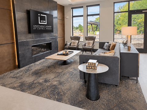 A modern living room with a fireplace and a flat screen TV mounted on the wall.