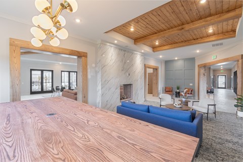 a large bedroom with a large wooden bed and a fireplace