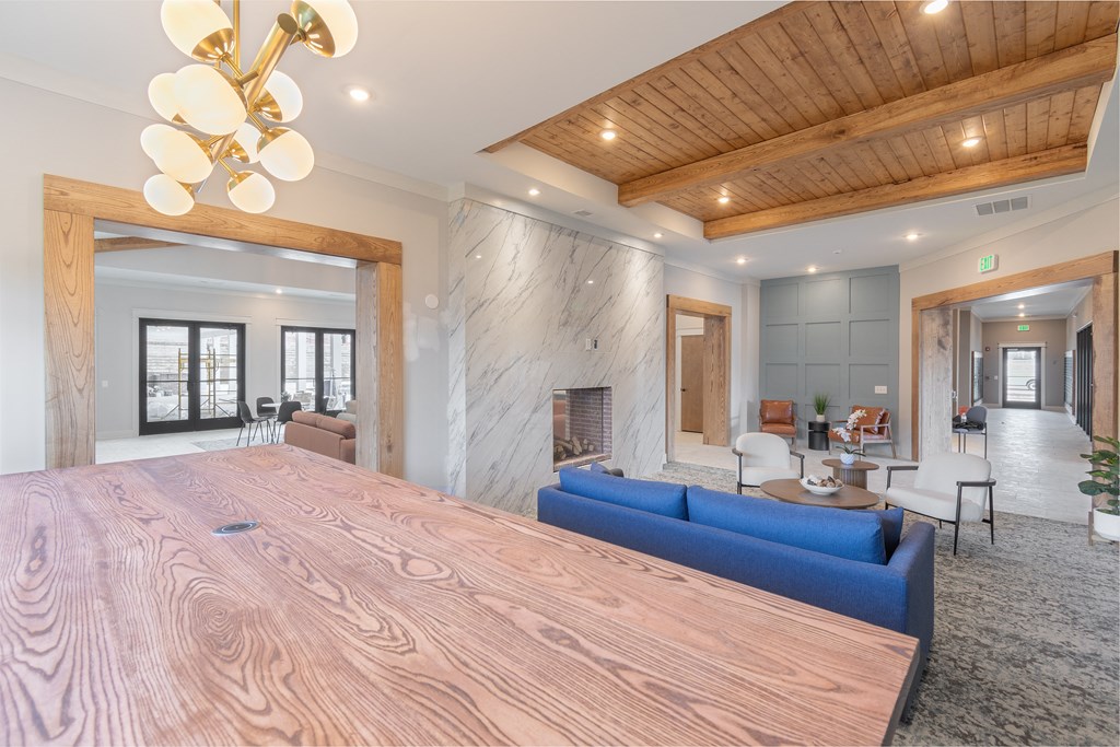 a large bedroom with a large wooden bed and a fireplace