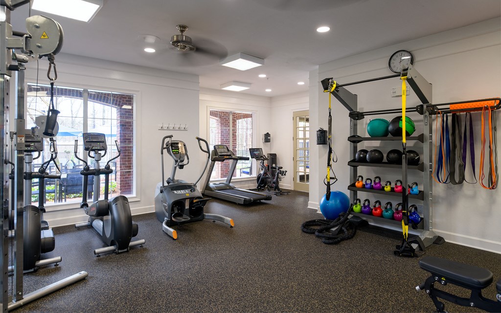 gym with exercise equipment and windows at the at the boulevard apartments rentals