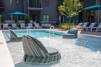 A pool with a chair in the middle of it.