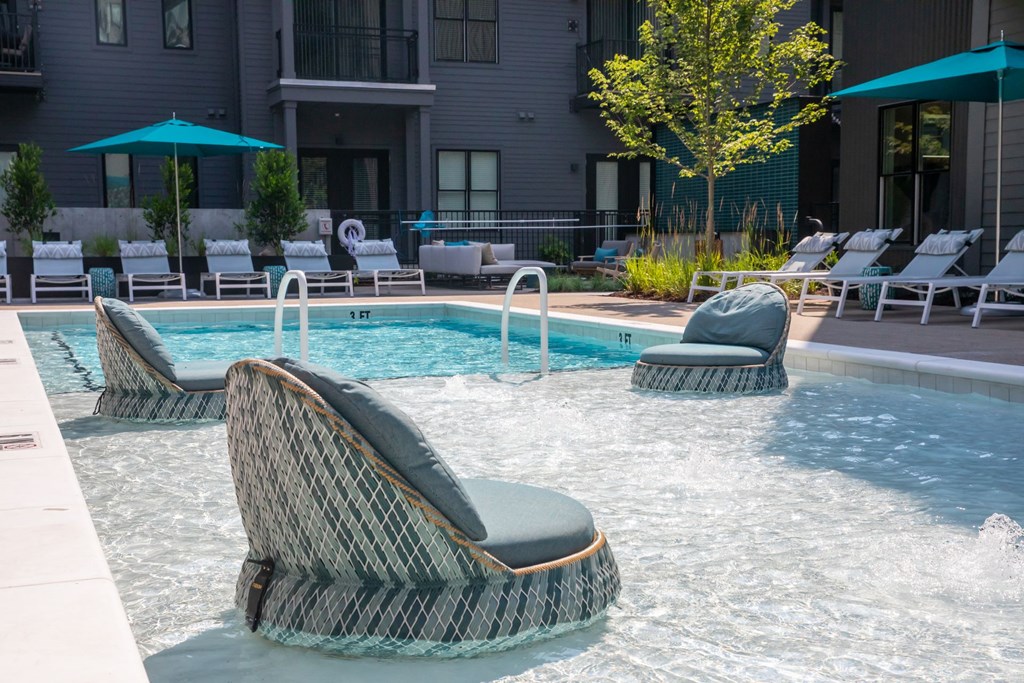 A pool with a chair in the middle of it.