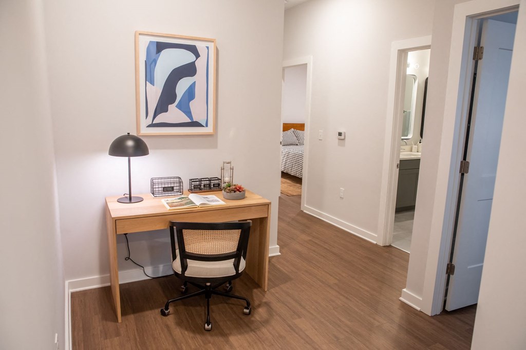 A room with a desk and a chair.