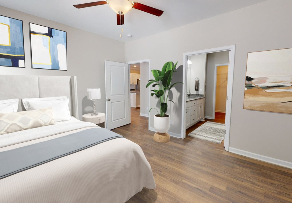 a bedroom with a bed and a ceiling fan