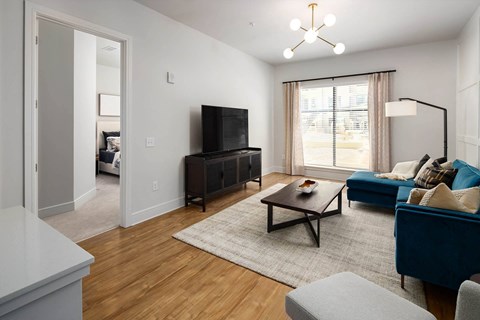 a living room with a couch and a tv