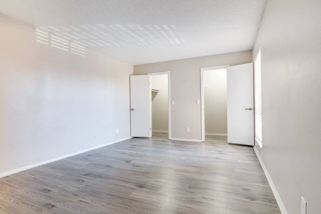 a room with shadows on the floor and walls