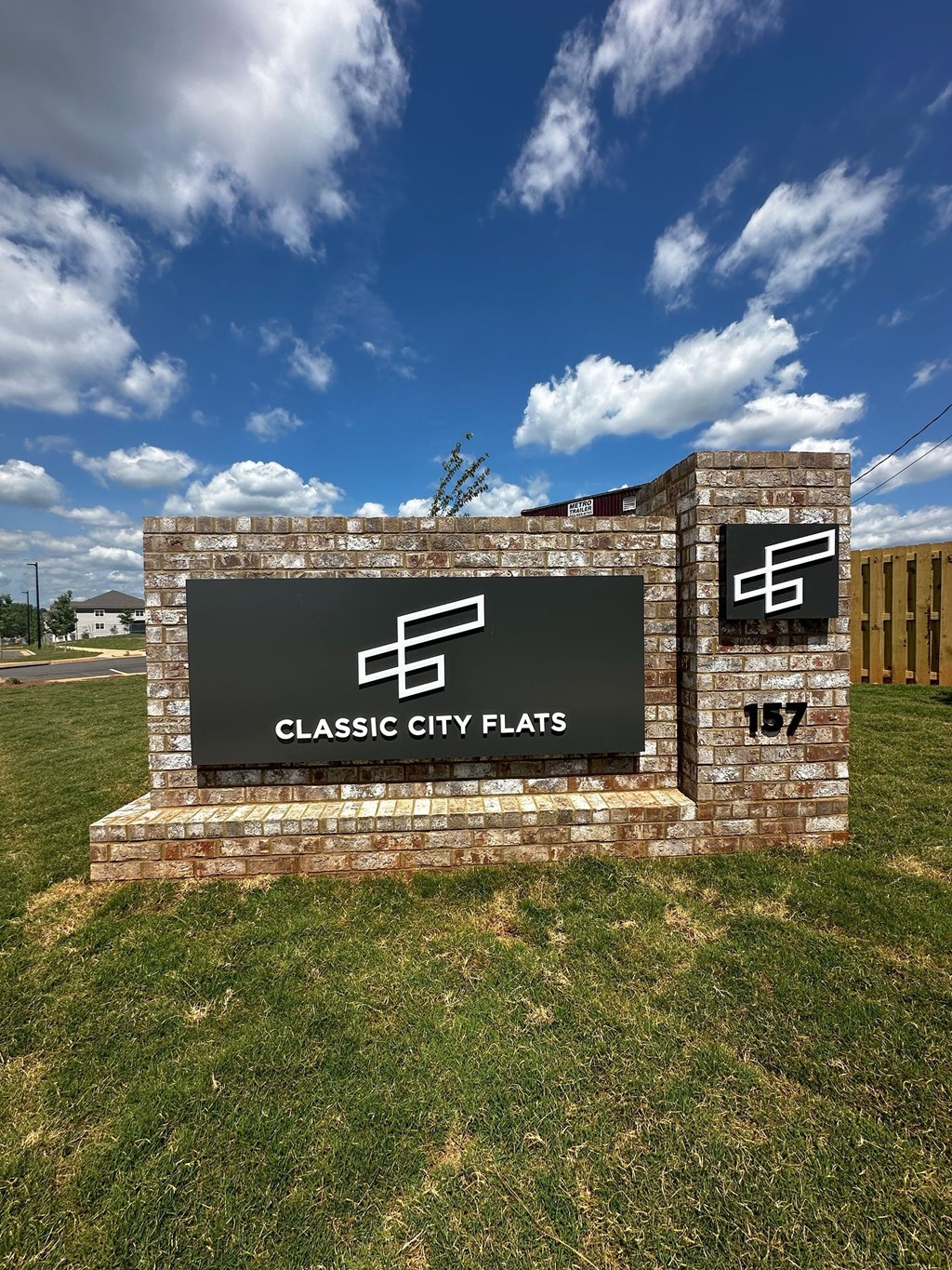 the sign for classic city flats at the entrance to the park
