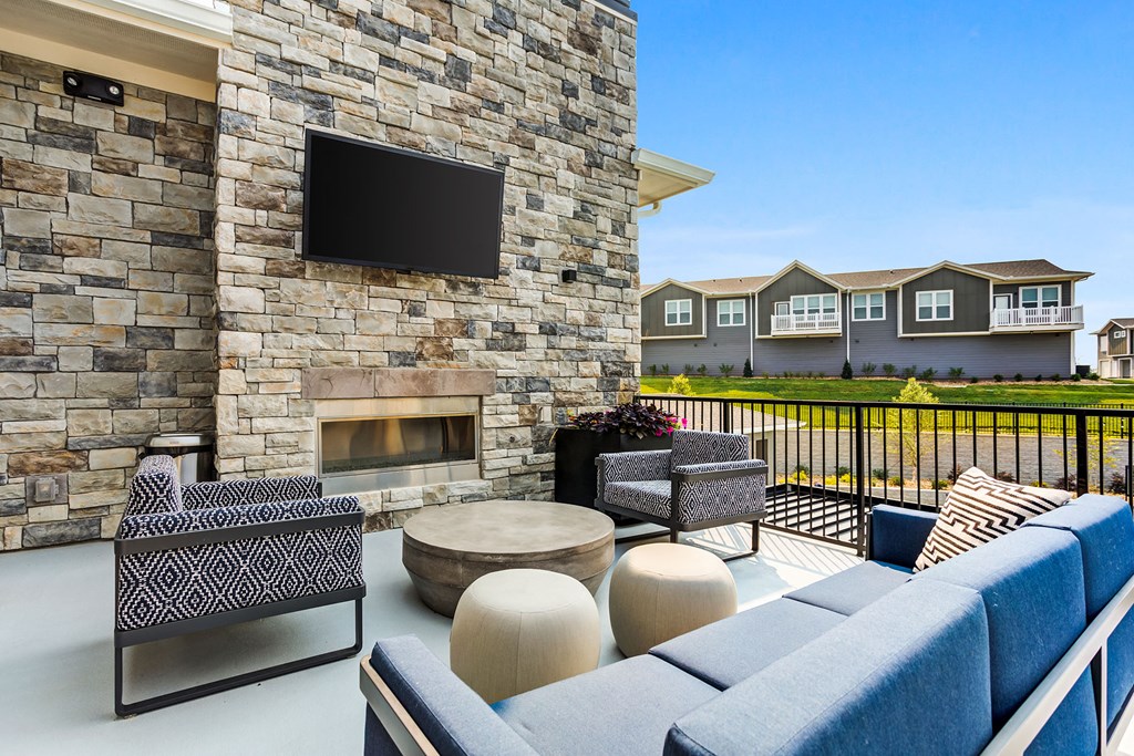 the preserve at ballantyne commons clubhouse with fireplace and seating area