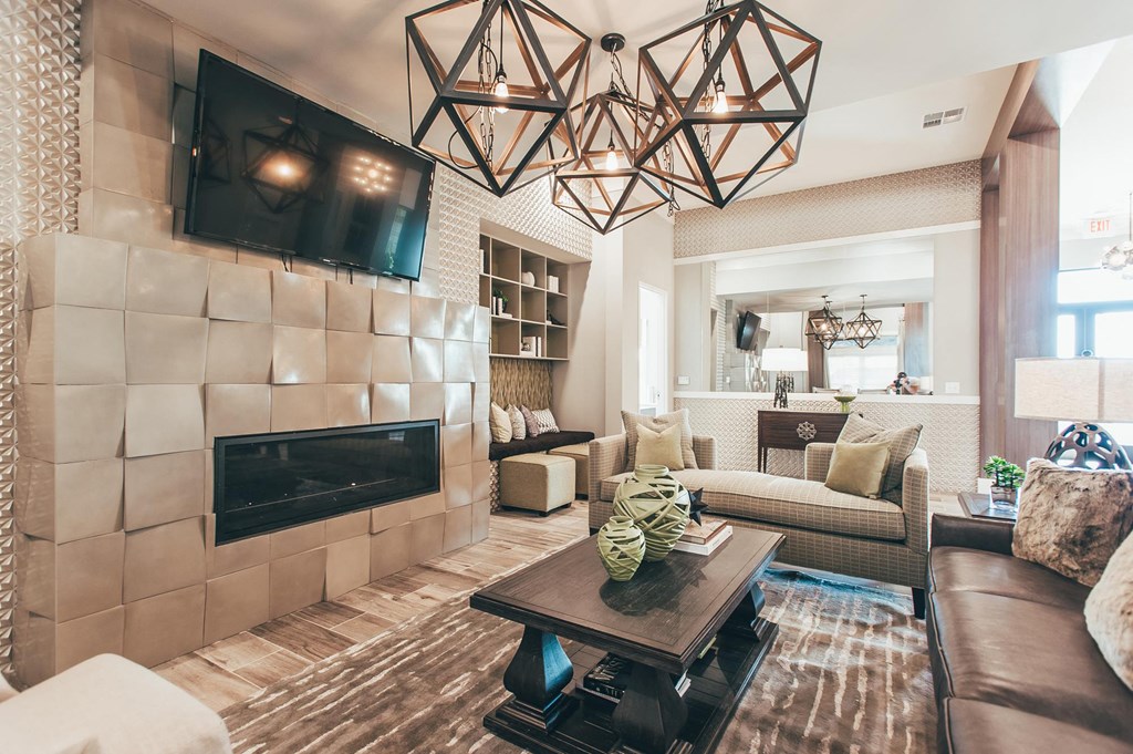 a living room with a fireplace and a television