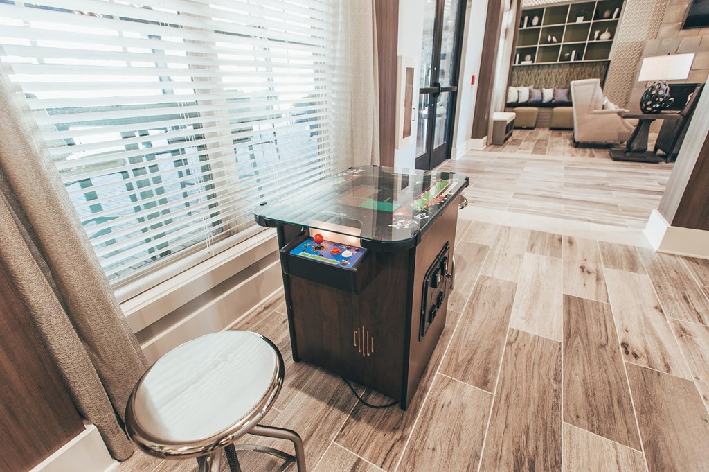 a game table in a living room with a large window