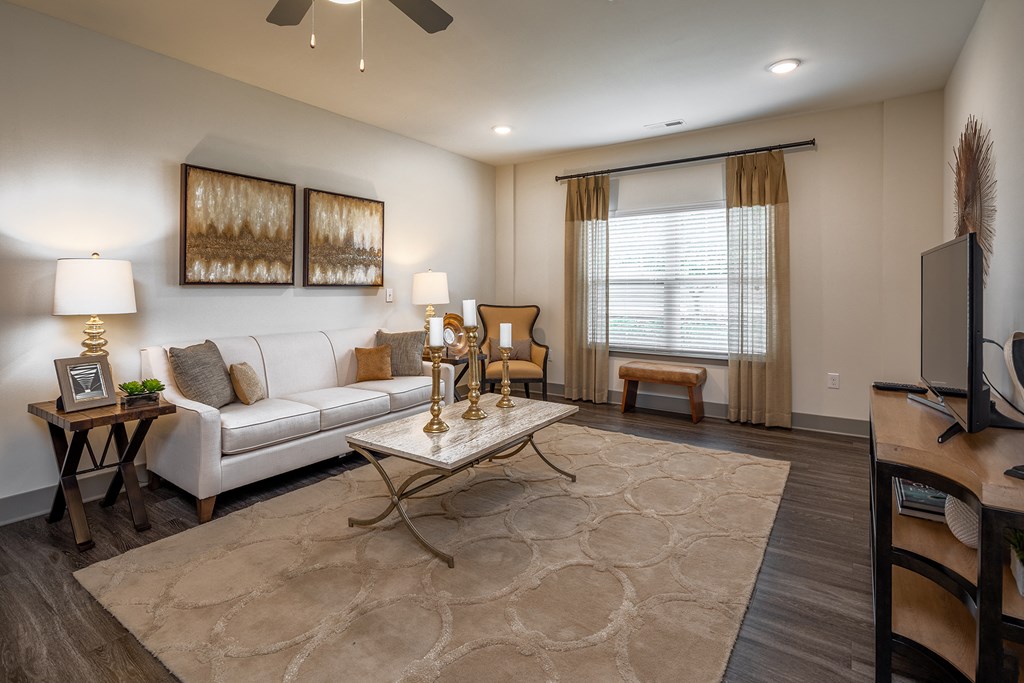 a living room with a white couch and a table