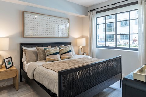 a bedroom with a bed and two windows at Leena Plantation, Plantation, 33322