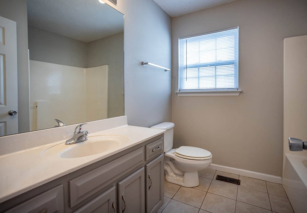 a bathroom with a sink toilet and bathtub