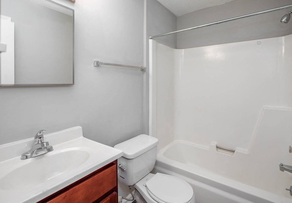 a bathroom with a sink toilet and bathtub