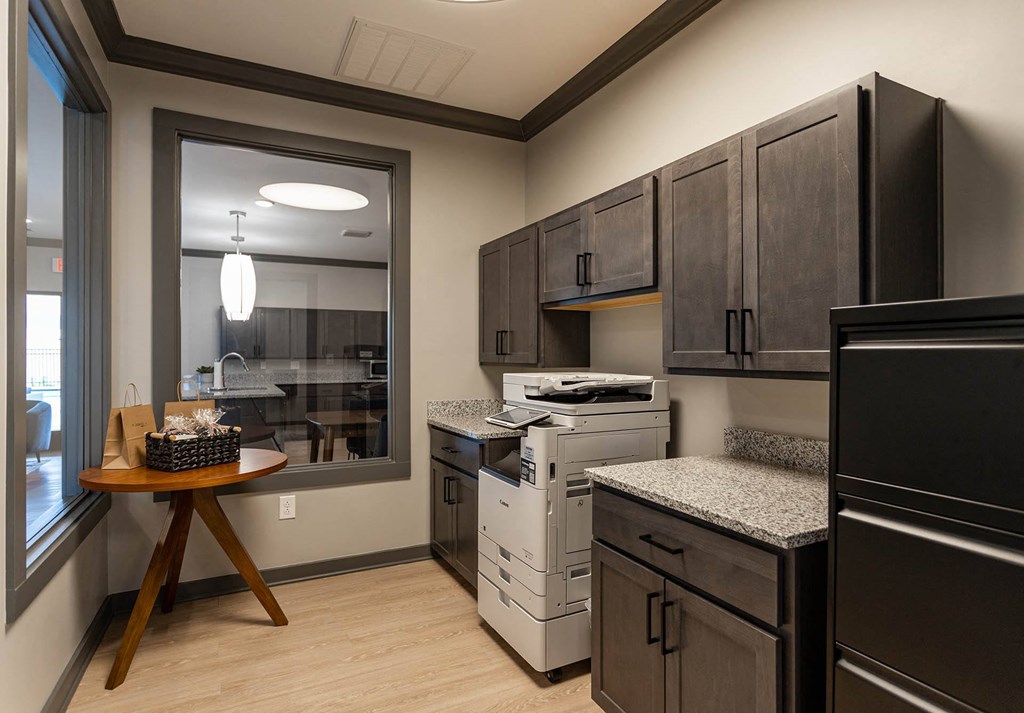 a kitchen with a stove top oven next to a window