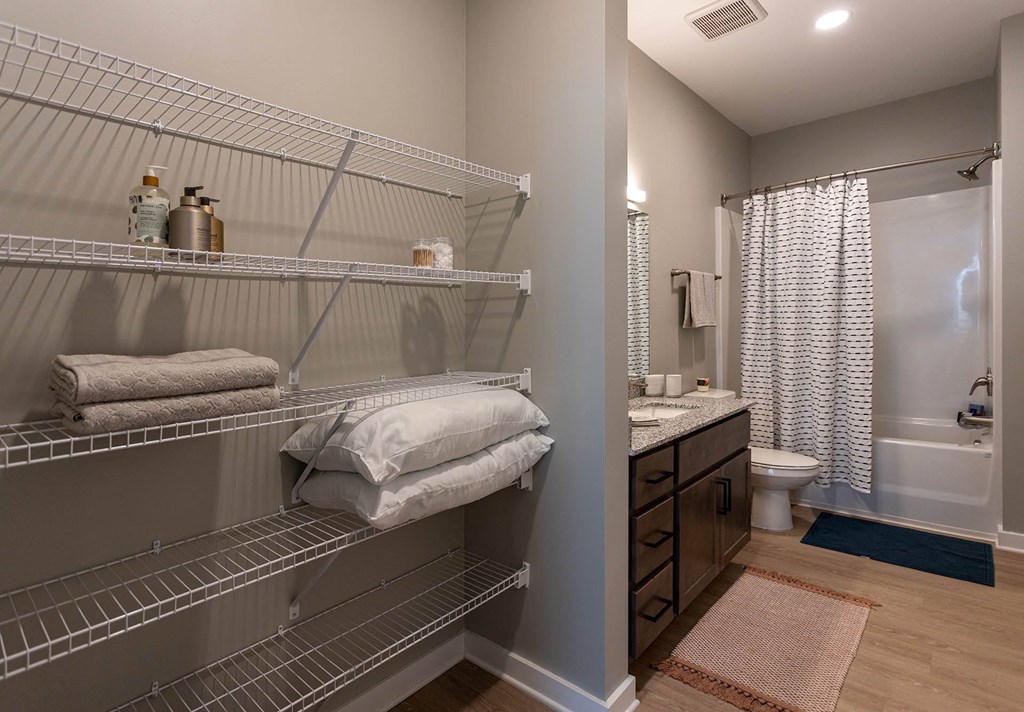 plenty of closet space in the bathroom at the flats at big tex apartments in san anton