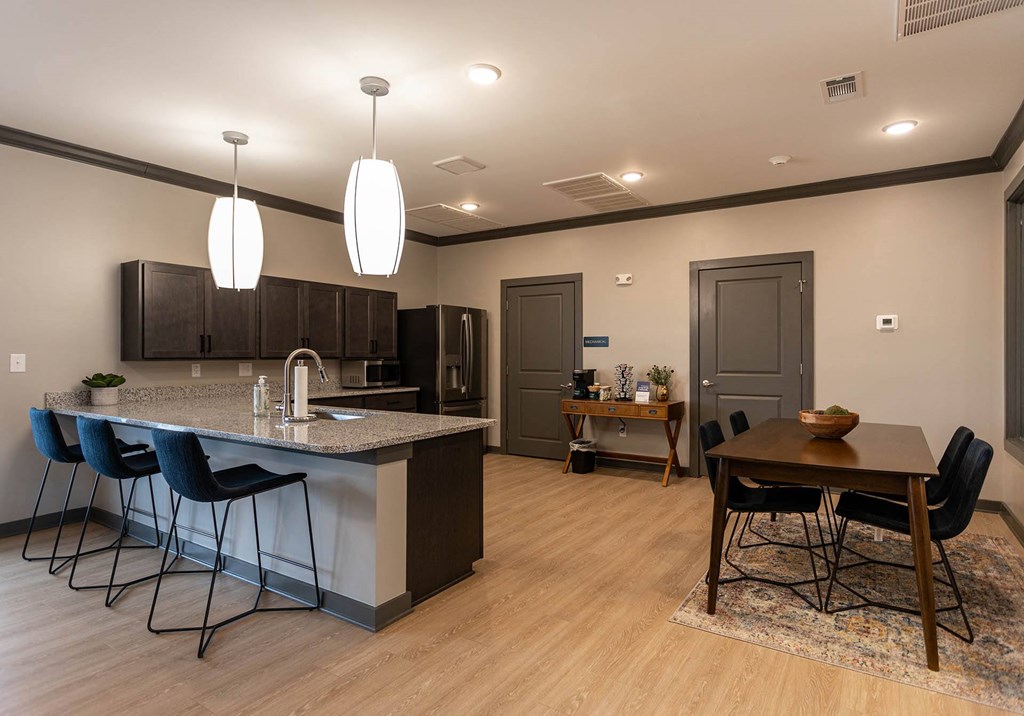 a kitchen and dining area in a clubhouse