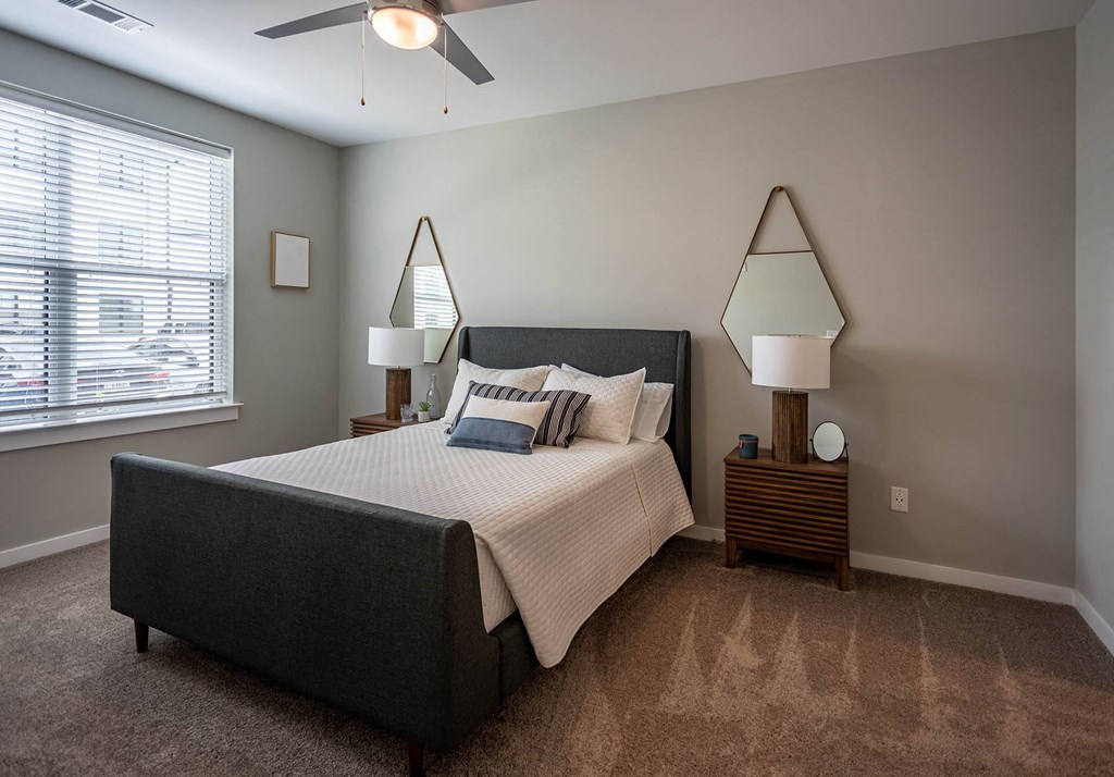 bedrooms with ceiling fans at the reserve at south coast apartments