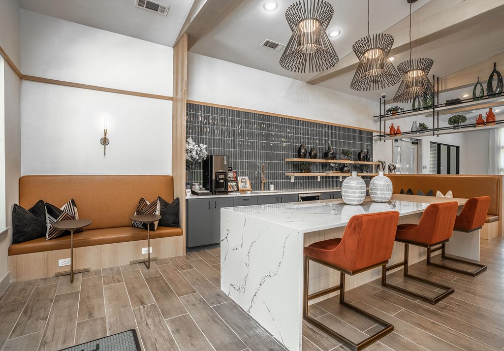 a kitchen and dining room with a table and chairs