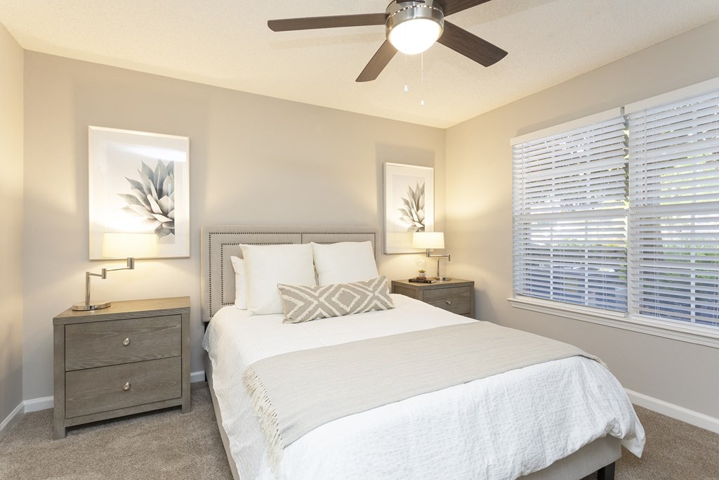 a bedroom with a bed and a ceiling fan at Crestmont at Thornblade, Greenville