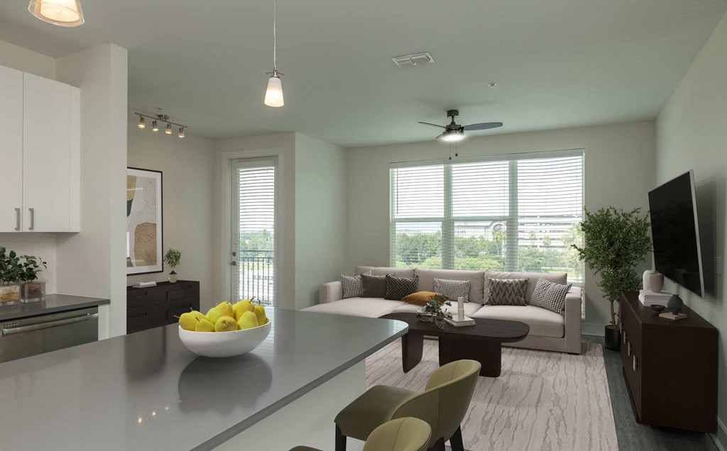 A modern kitchen with a bowl of lemons on the counter.