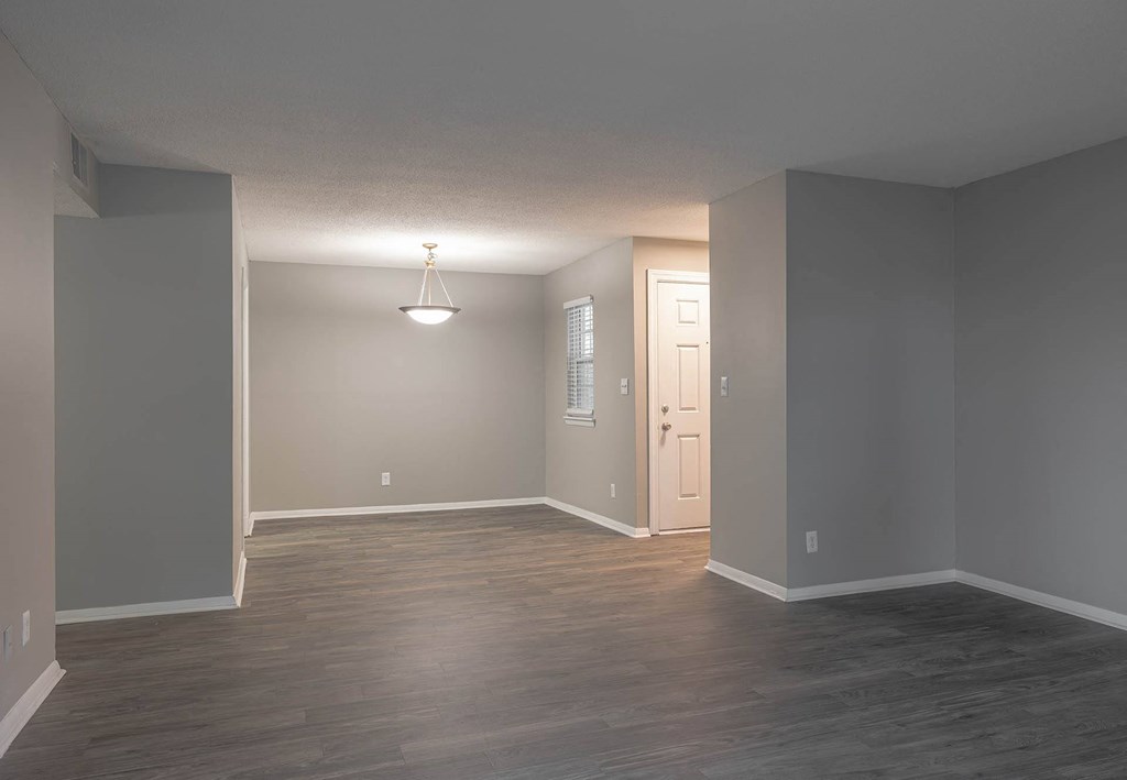 an empty room with a chandelier