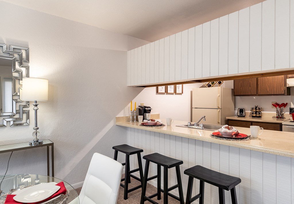 a kitchen and dining area in a 555 waverly unit  at Pheasant Run, Saginaw, MI