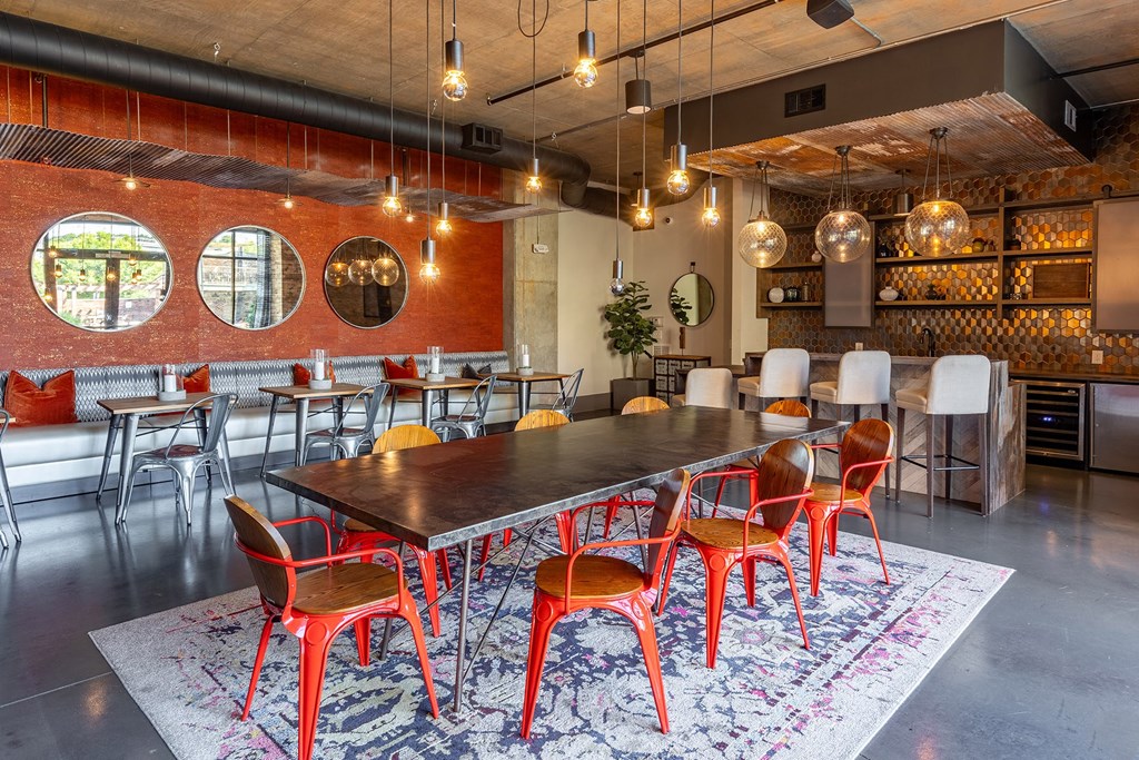 a large dining room with a long table and chairs