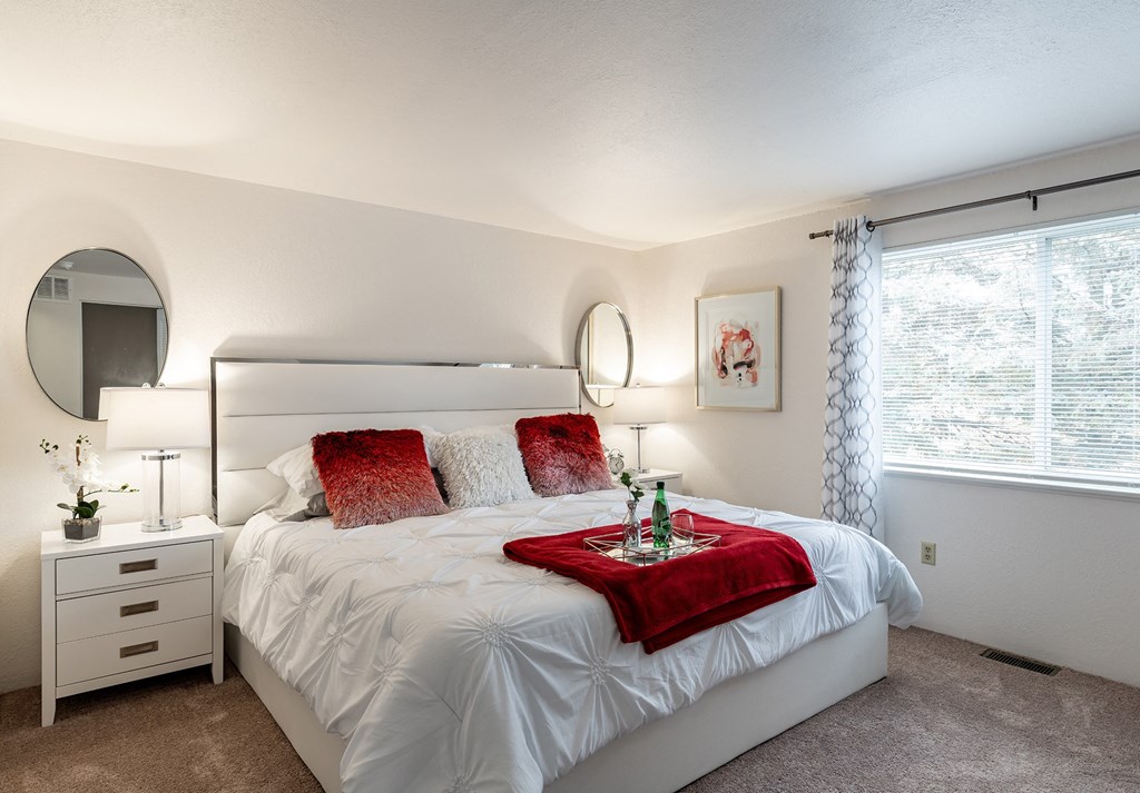 our apartments offer a bedroom with a king size bed  at Pheasant Run, Saginaw, MI