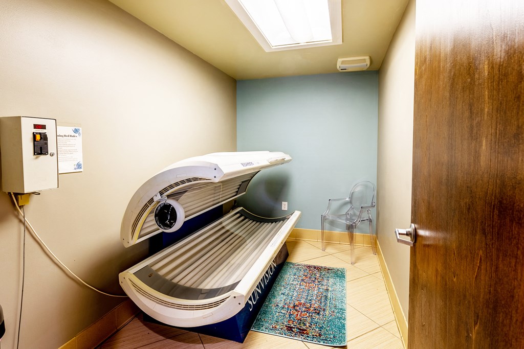 a room with a dryer and a heater in a bathroom