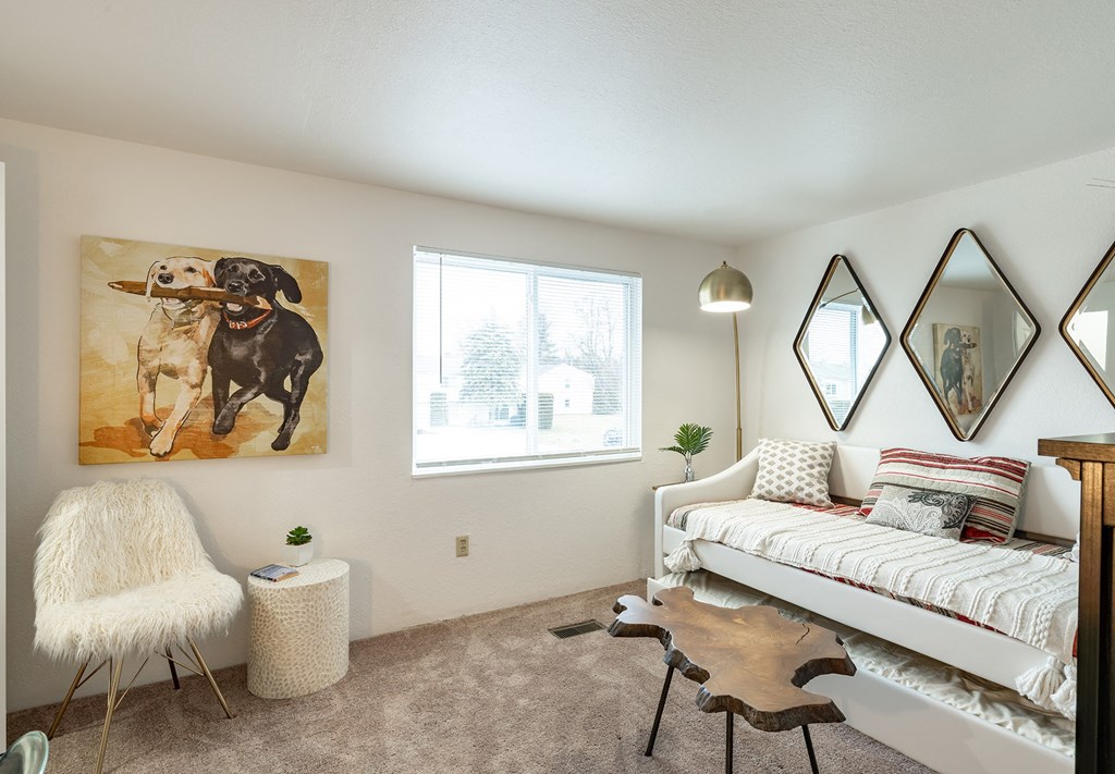 a bedroom with white walls and carpet  at Pheasant Run, Saginaw, Michigan