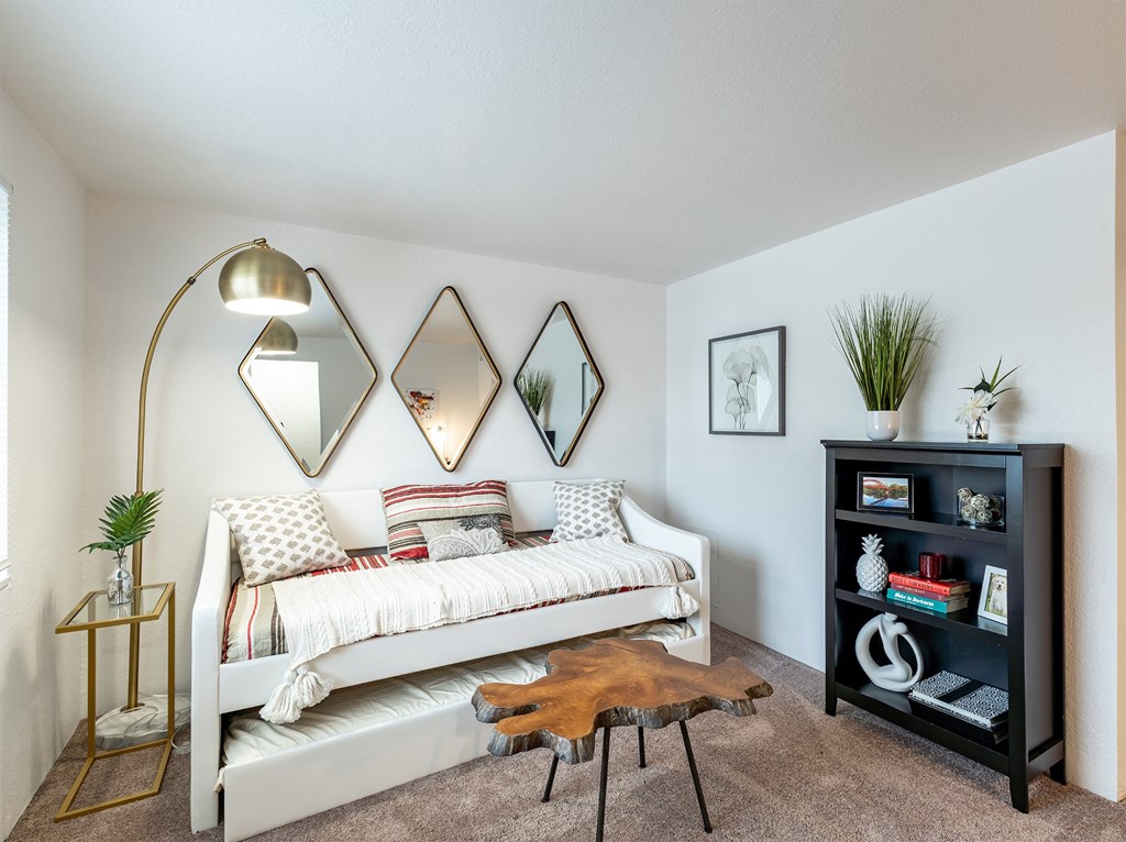a bedroom with a bed and a bookshelf  at Pheasant Run, Saginaw, Michigan