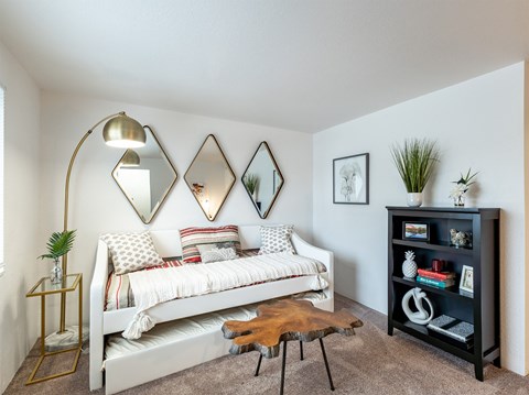 a bedroom with a bed and a bookshelf  at Pheasant Run, Saginaw, Michigan