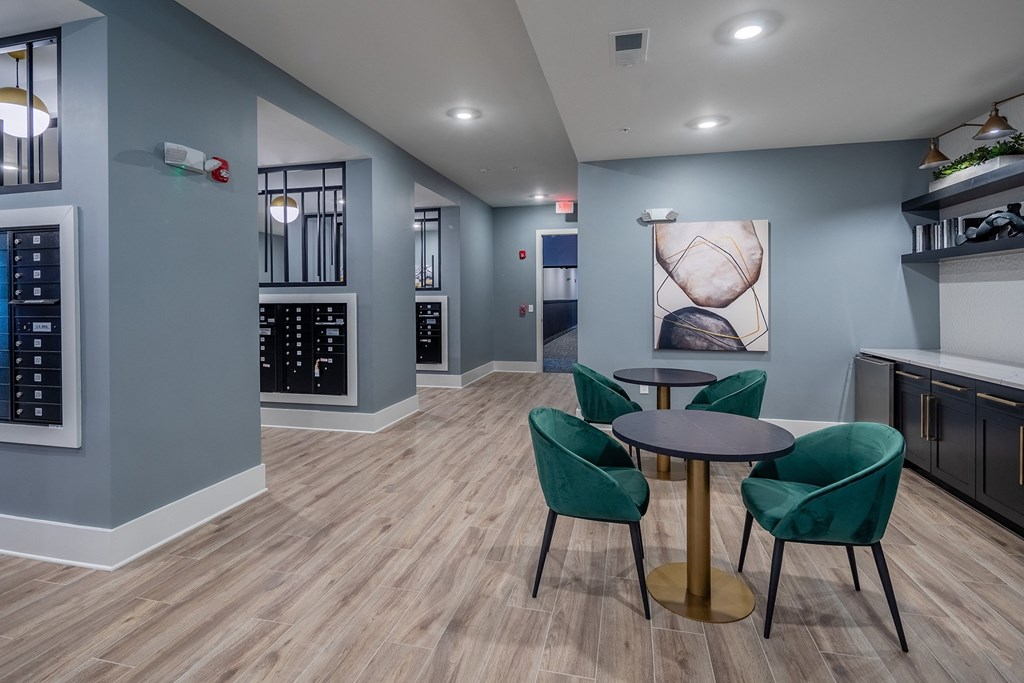 a dining room with a table and chairs and a kitchen