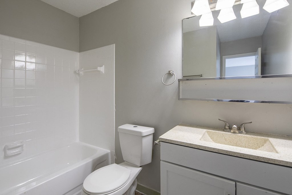 an empty bathroom with a toilet and a sink