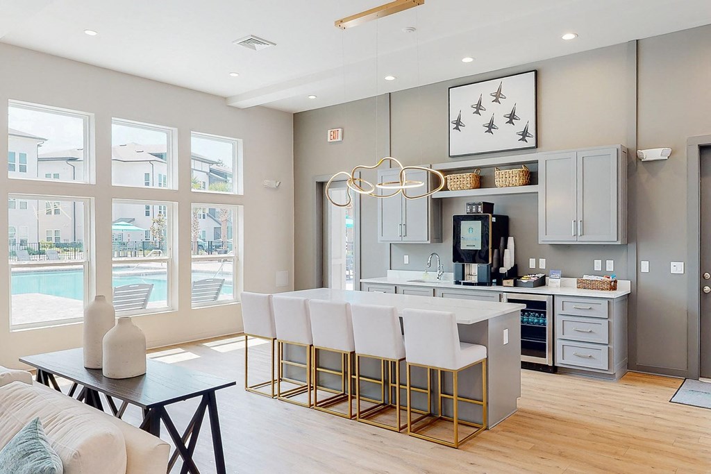 a kitchen with an island and a living room