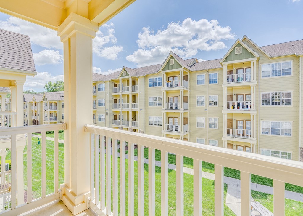 the view of an apartment building from a balcony