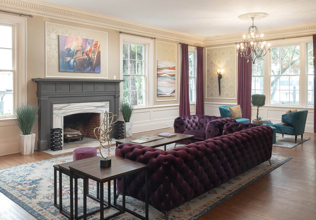 a living room filled with furniture and a fire place