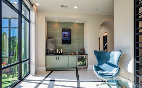 the lobby of a dental office with a blue chair
