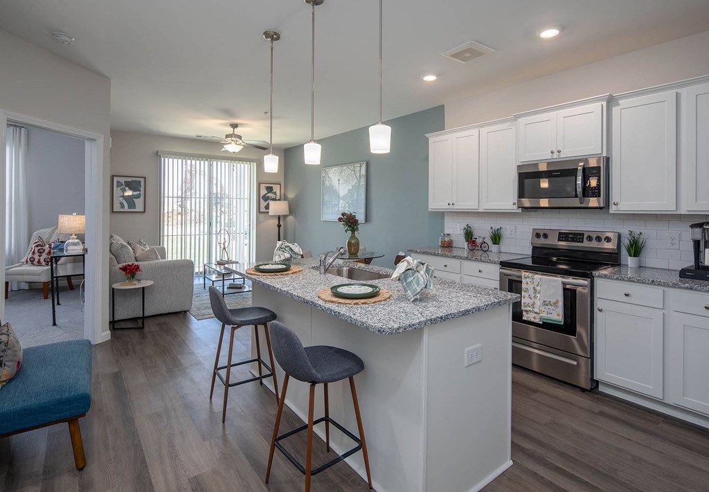 a kitchen with an island and stools