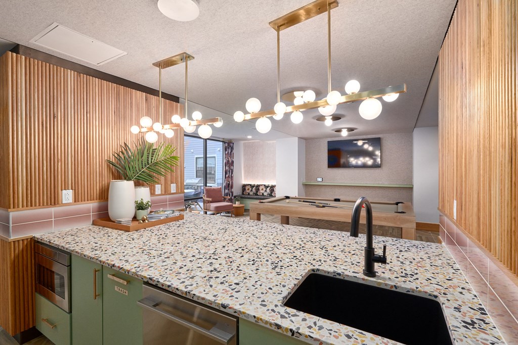 a kitchen with a large counter top and a sink