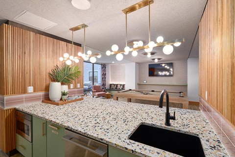 a kitchen with a large counter top and a sink