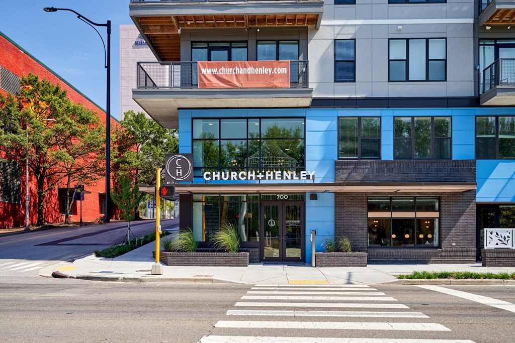 a building with a sign on the side of a street
