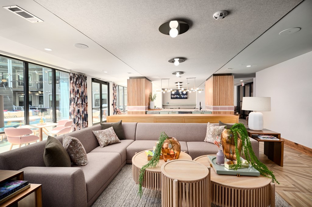 a living room with a couch and tables