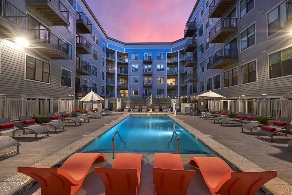 a swimming pool in the middle of an apartment building