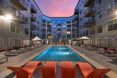a swimming pool in the middle of an apartment building