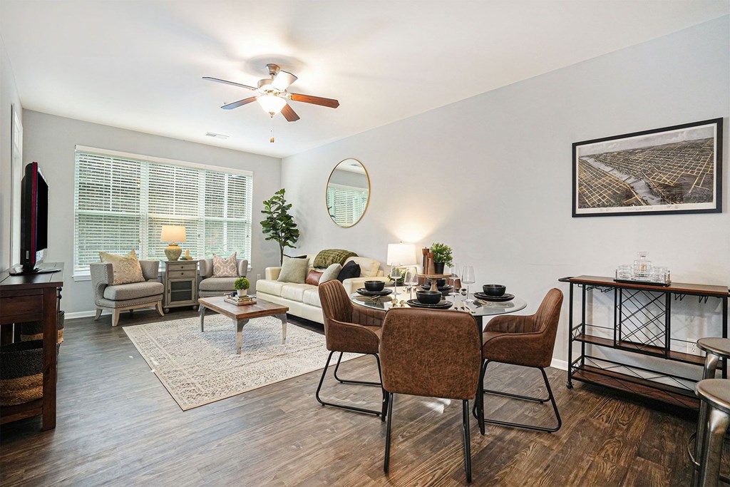 A dining room with a table set for six.