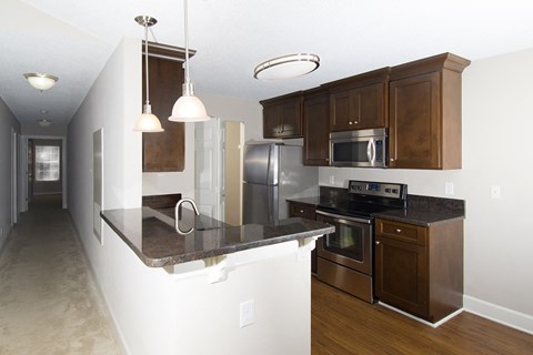a kitchen with stainless steel appliances and a counter top