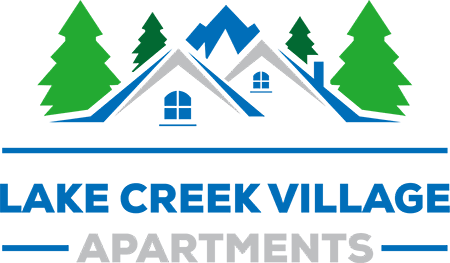 a house with trees in the background and the words lake creek village apartments in the foreground